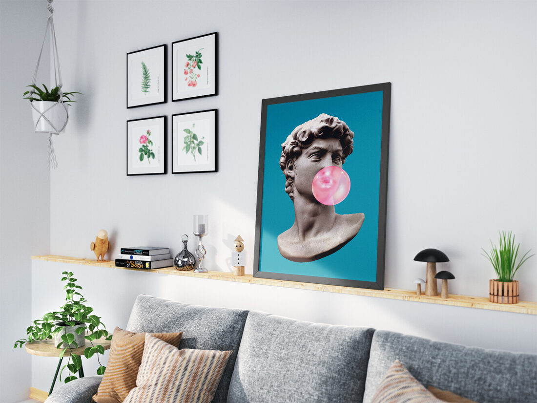 Close-up of Michelangelo's David marble bust blowing a large, translucent pink bubblegum bubble against a teal background.