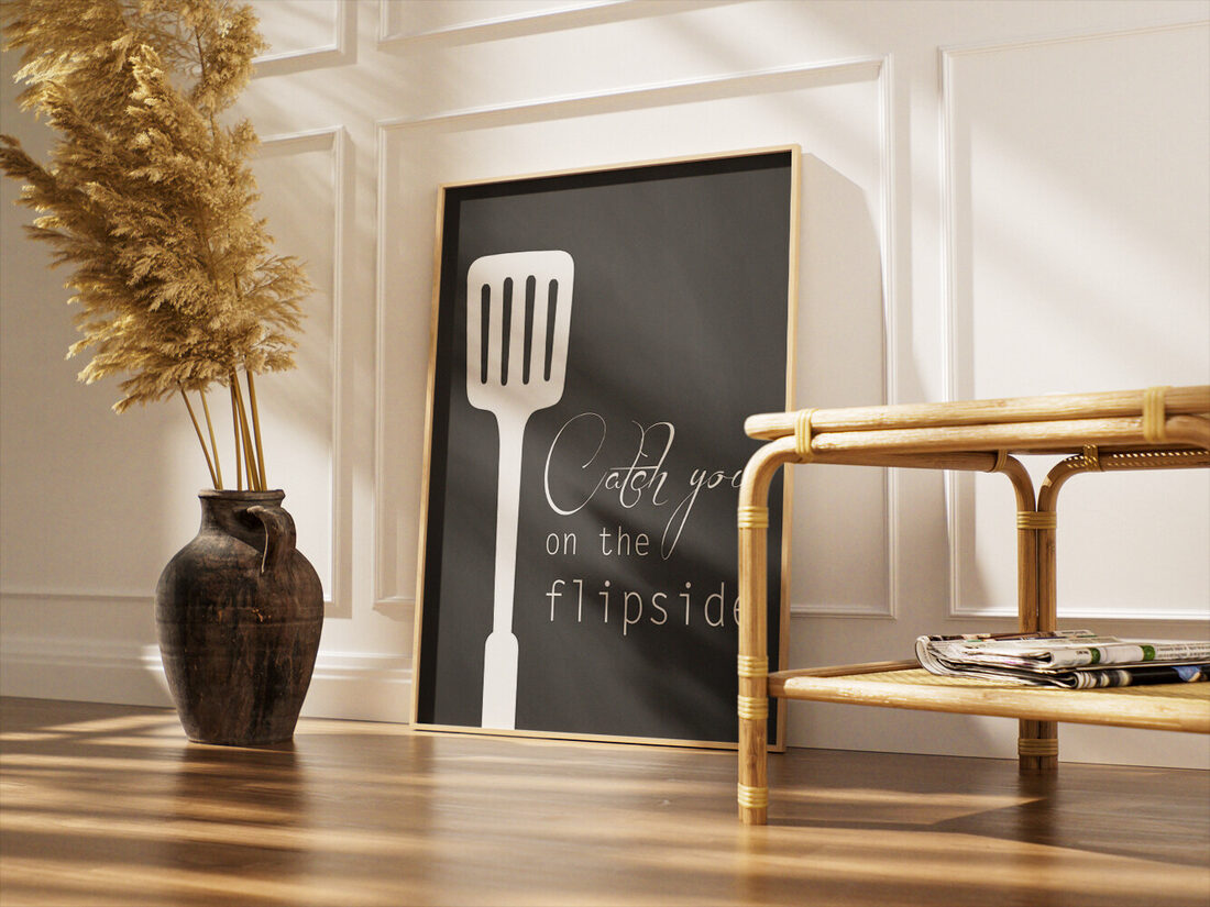 White kitchen spatula silhouette on a dark chalkboard background with the text 'Catch you on the flipside' in white.