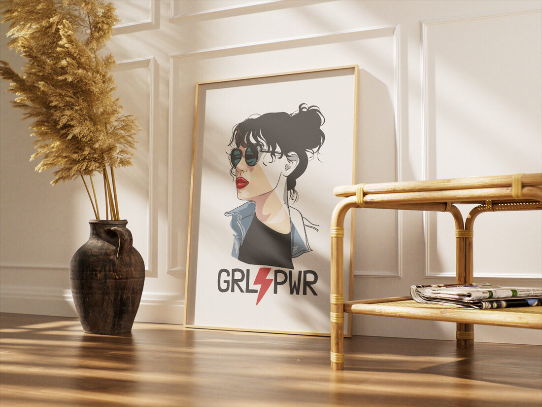 Stylized illustration of a woman with dark hair in a bun, wearing sunglasses and a denim jacket, with 'GRL⚡PWR' text below.