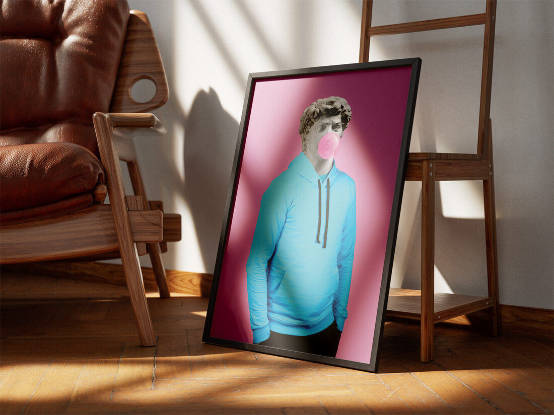 Modern art piece featuring Michelangelo's David statue in a blue hoodie blowing pink bubble gum on a pink background.