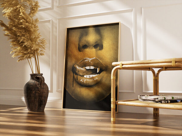 A close-up digital painting of a mouth with glossy golden-brown lips, prominent white vampire fangs, and a tongue licking the lower lip, with a dark l