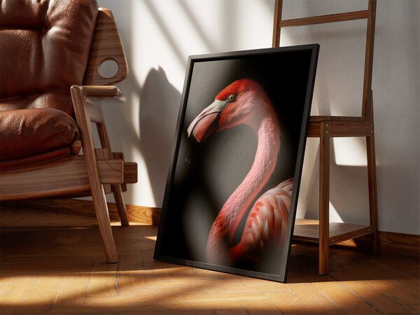Close-up profile photograph of a vibrant pink flamingo with a white and black beak against a dark, contrasting background.